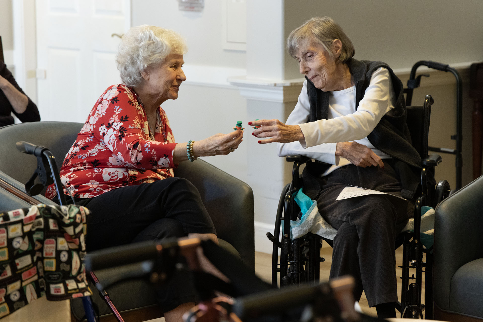 Senior and caregiver laughing
